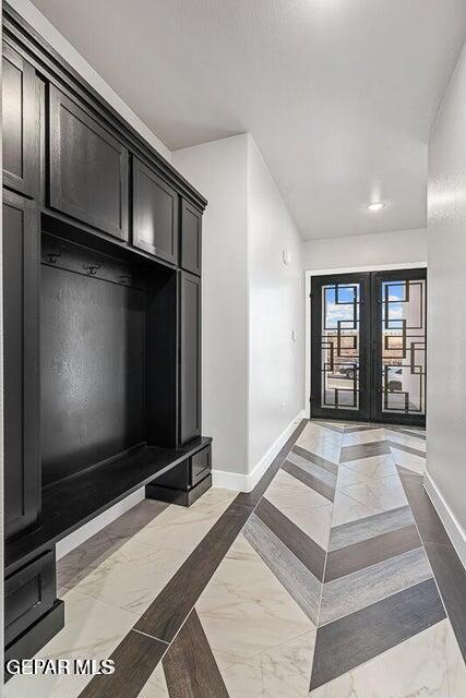 7353 Cimarron Rim Road El Paso, TX 79911 - Photo 2 of 30 a living room with a large window and a flat screen tv