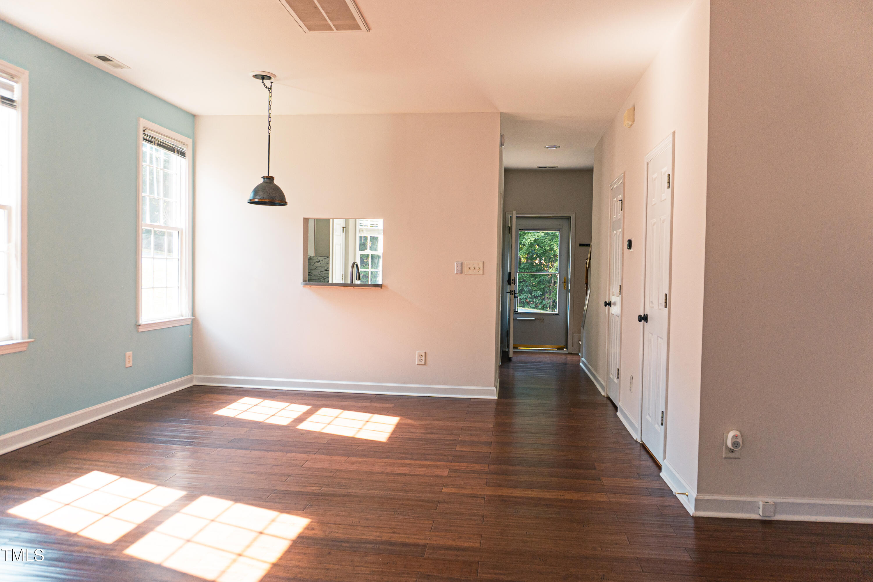 2271 Trailwood Valley Circle Raleigh, NC 27603 - Photo 15 of 36 an empty room with wooden floor and windows