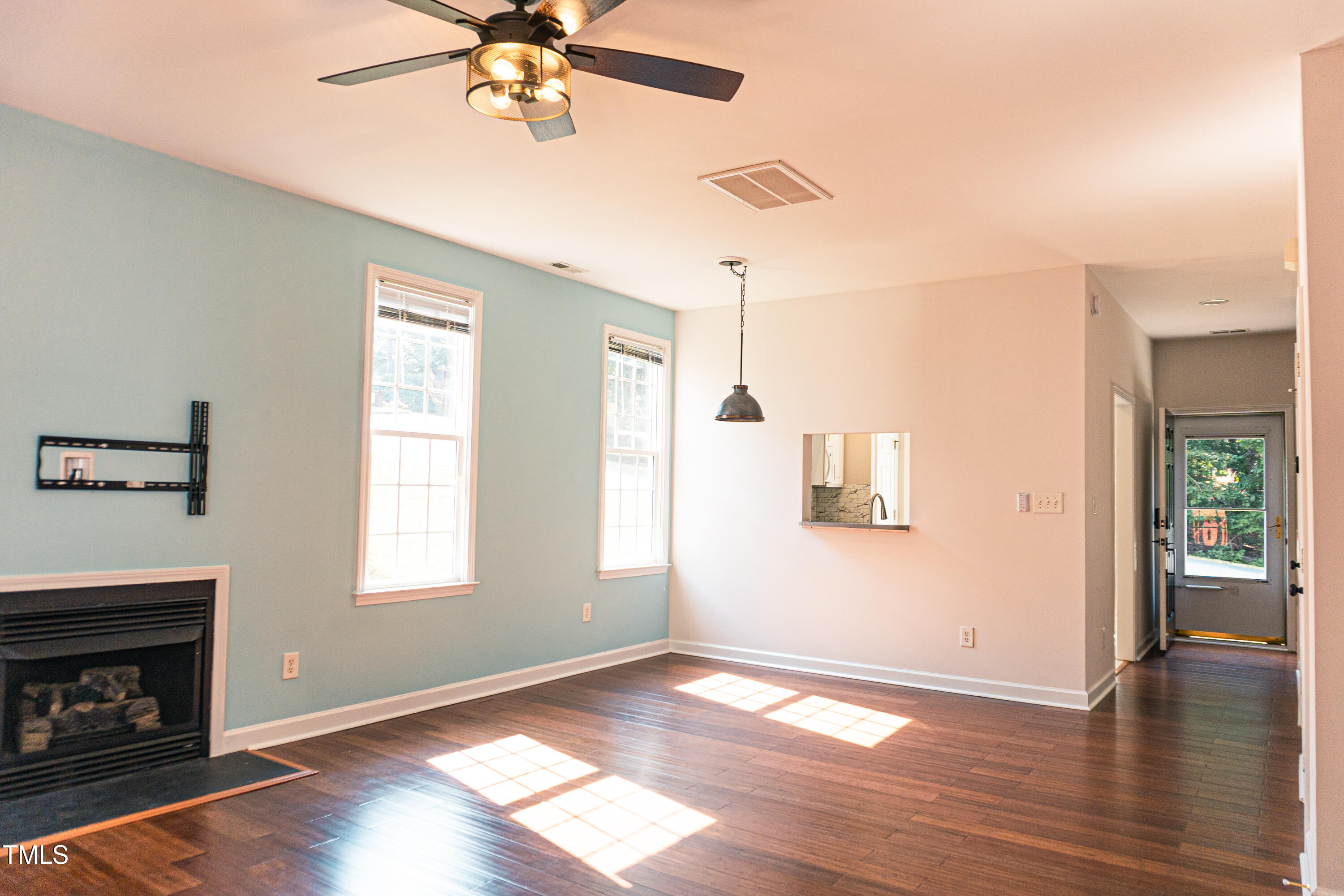 2271 Trailwood Valley Circle Raleigh, NC 27603 - Photo 16 of 36 a view of an empty room with wooden floor and a window