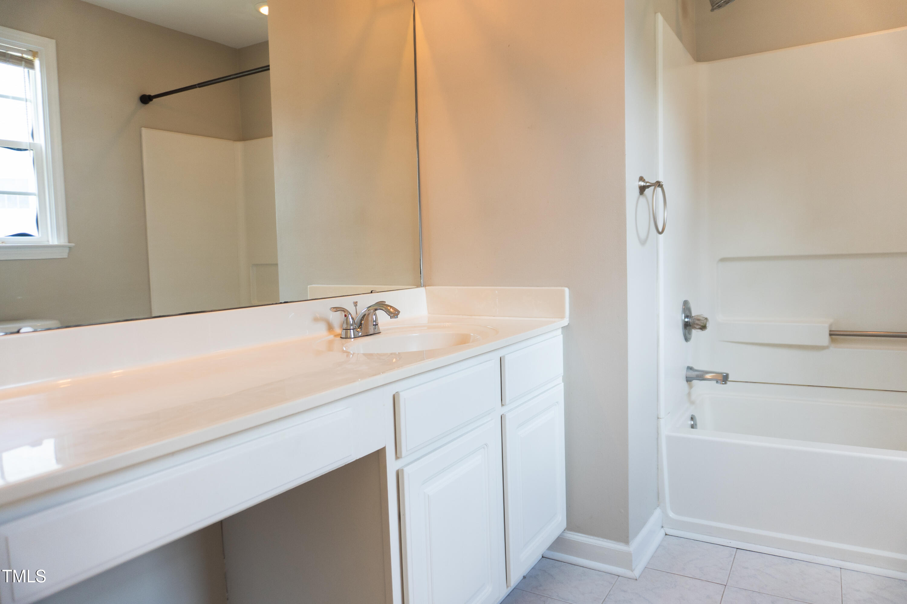 2271 Trailwood Valley Circle Raleigh, NC 27603 - Photo 25 of 36 a bathroom with a bathtub and a sink