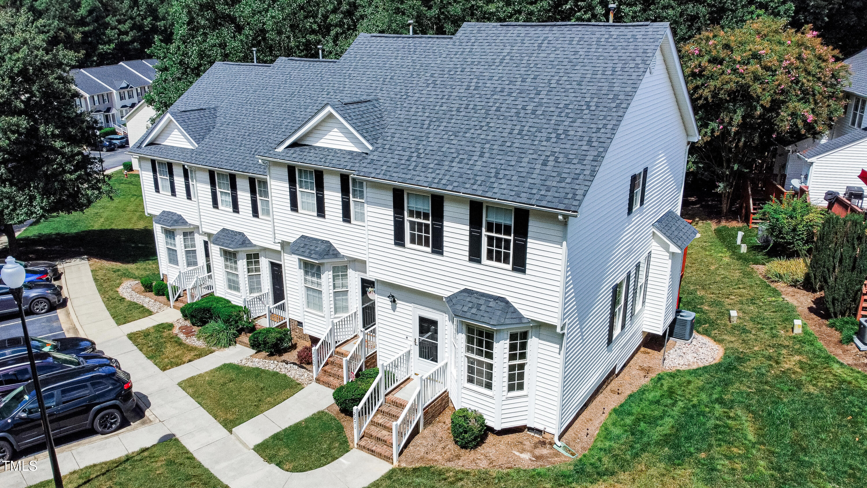2271 Trailwood Valley Circle Raleigh, NC 27603 - Photo 2 of 36 a aerial view of a house with a yard table and chairs