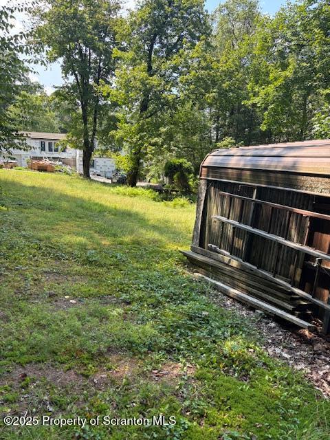 Lewis Nicholson, PA 18446 - Photo 4 of 8 a view of a yard with wooden fence