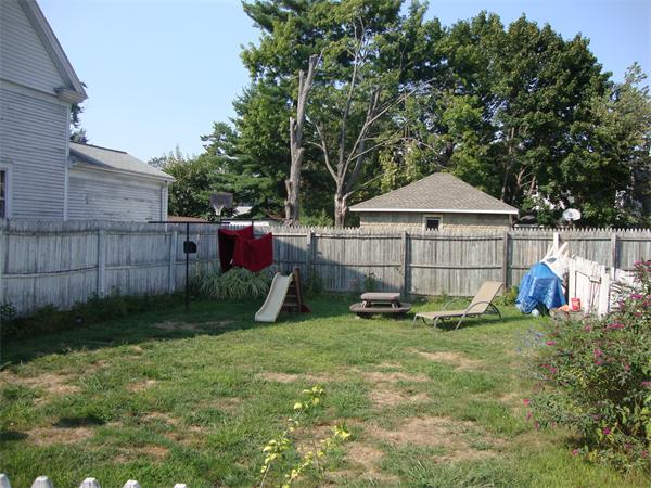 26-28 Pasco Road Springfield, MA 01151 - Photo 4 of 4 a view of a backyard with a garden and deck