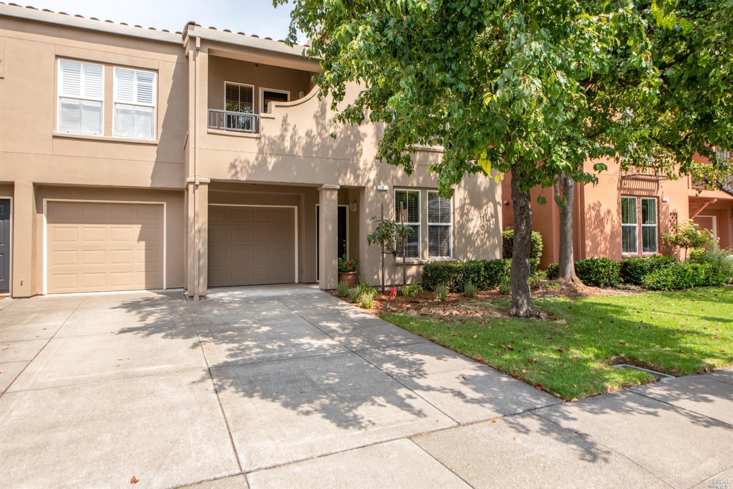 7 Gann Way Novato, CA 94949 - Photo 1 of 1 a front view of a house with a yard and a garage