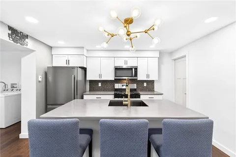 a view of a storage & utility room with washer and dryer