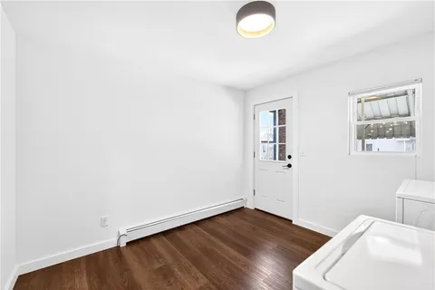 a view of empty room with a fireplace