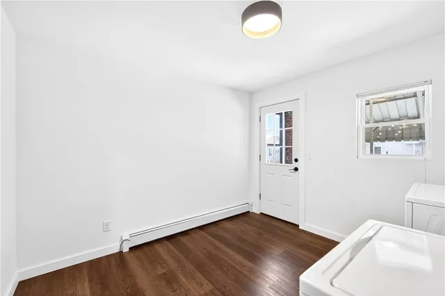 a view of empty room with a fireplace