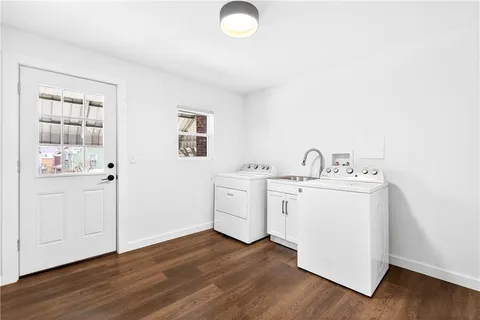 a view of an empty room with a ceiling fan