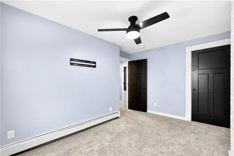 a bathroom with a sink mirror toilet and tub
