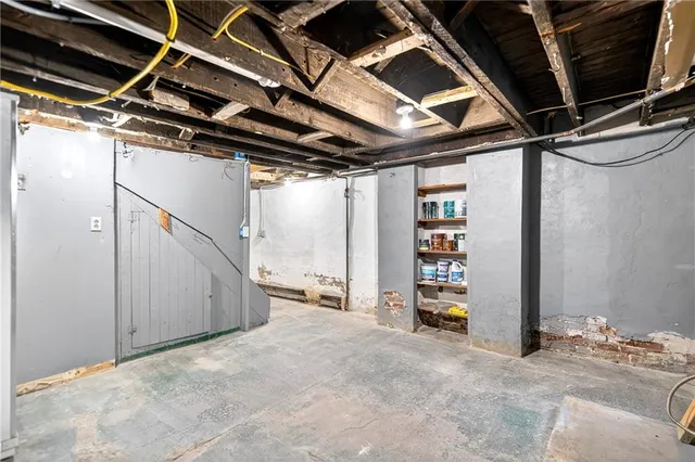 a bedroom with bed window and table