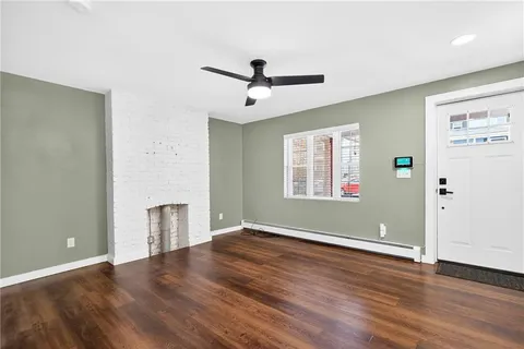 a kitchen with stainless steel appliances a refrigerator a stove a microwave oven a sink with island and chairs