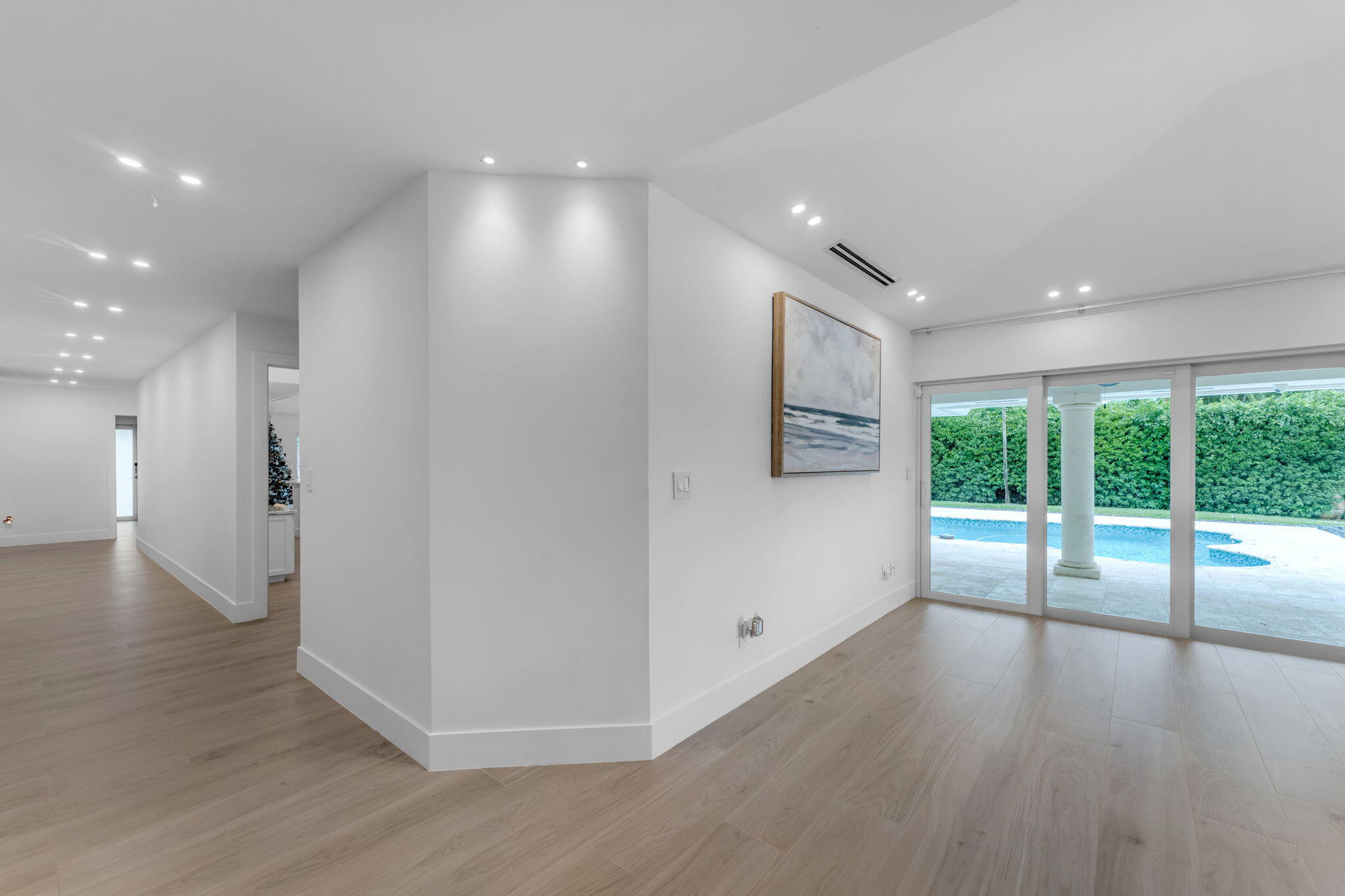 16941 Southwest 278th Street Homestead, FL 33031 - Photo 14 of 44 a view of a big room with wooden floor and windows