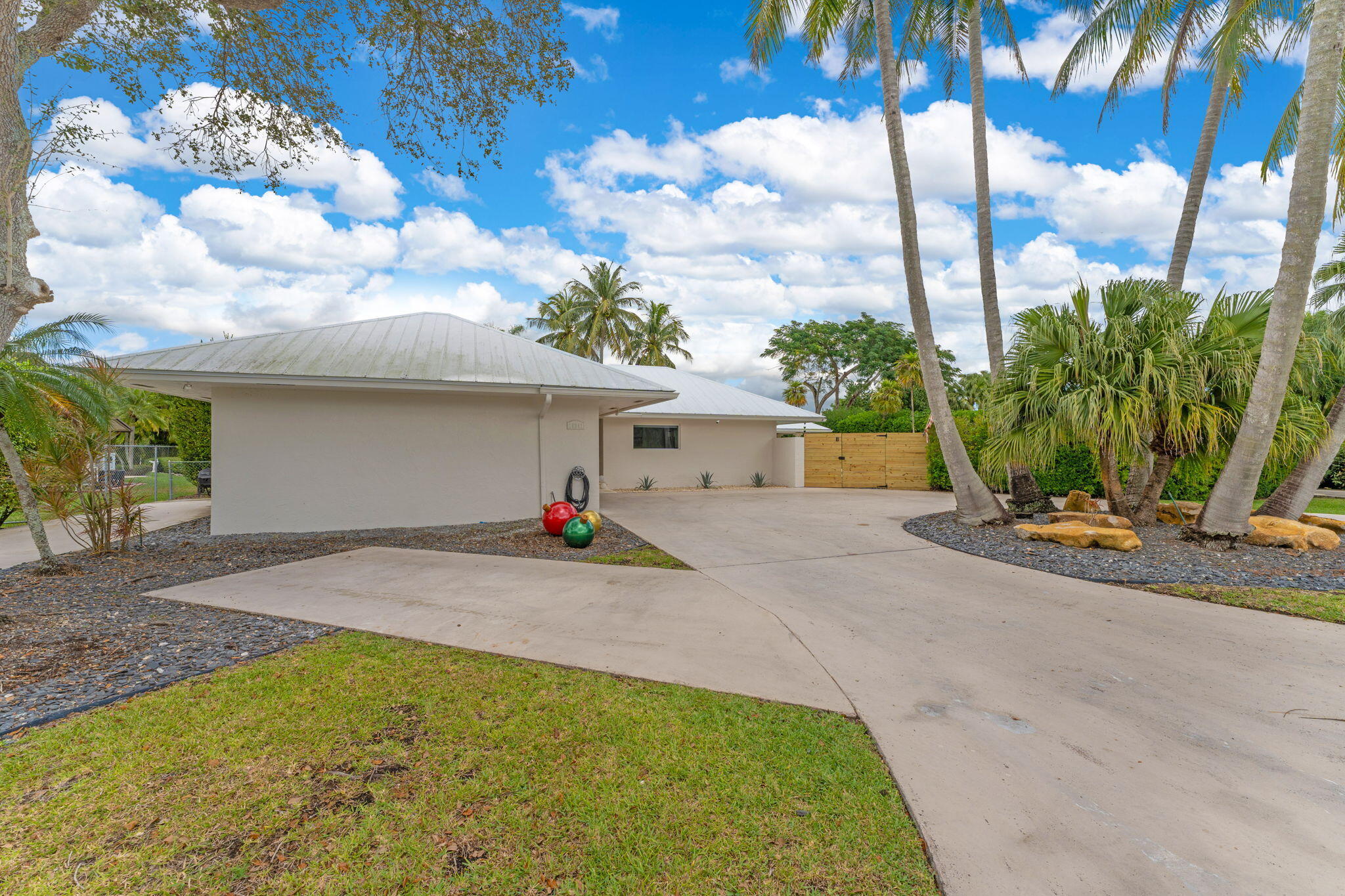 16941 Southwest 278th Street Homestead, FL 33031 - Photo 22 of 44 a view of a house with a backyard and a garage