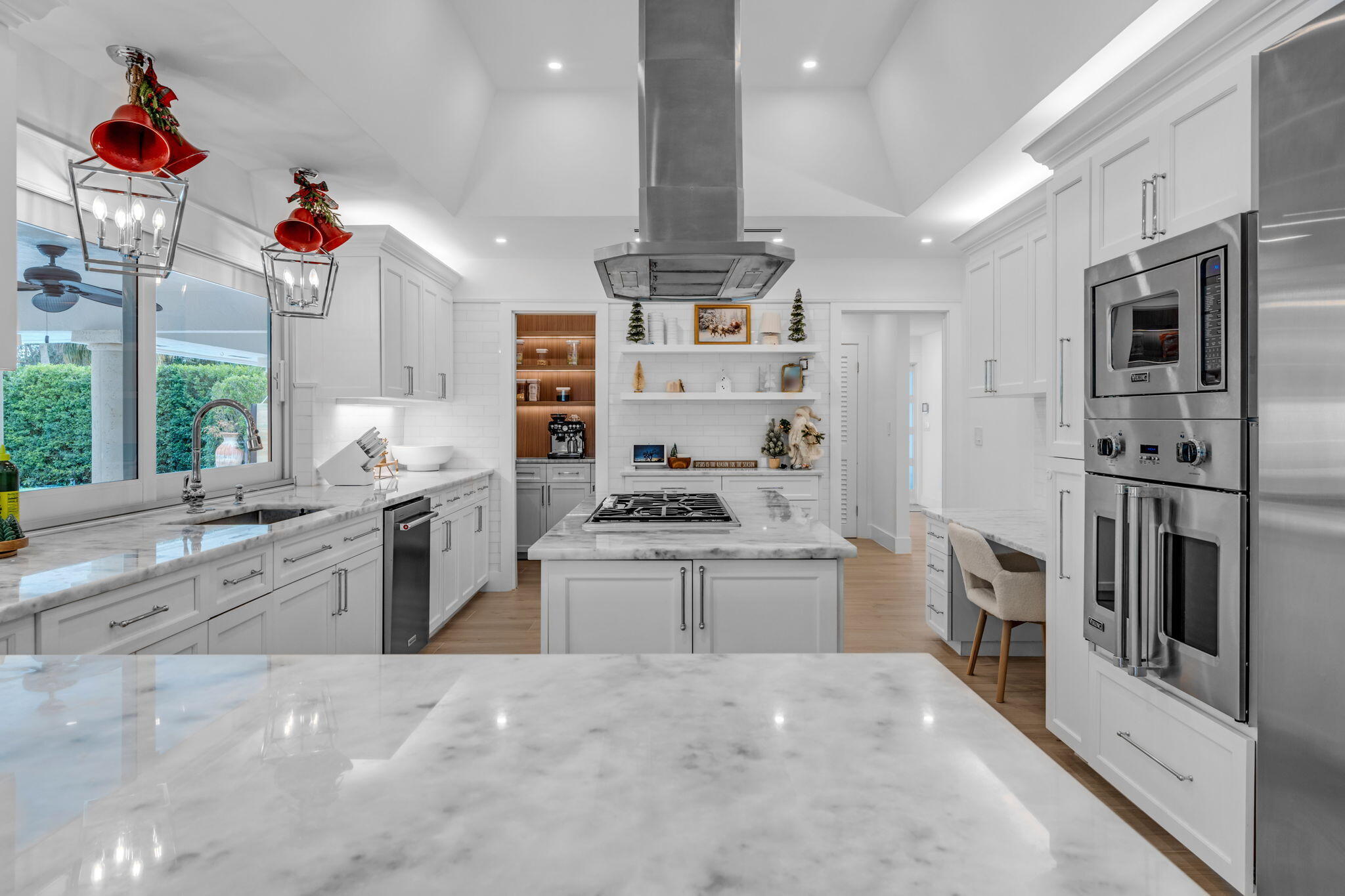 16941 Southwest 278th Street Homestead, FL 33031 - Photo 36 of 44 a kitchen with stainless steel appliances kitchen island granite countertop a stove and a sink