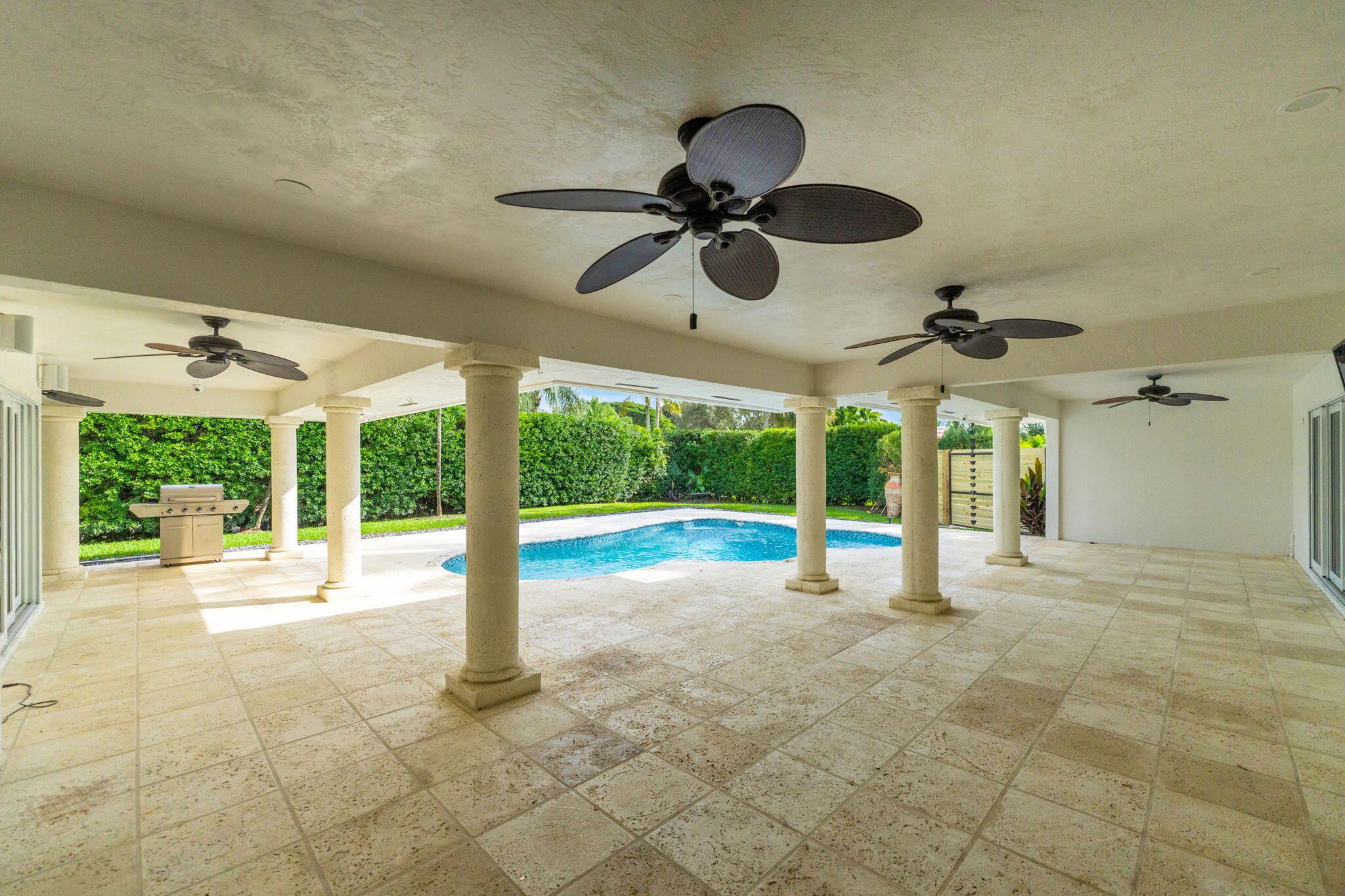 16941 Southwest 278th Street Homestead, FL 33031 - Photo 42 of 44 a view of a porch with furniture and a yard