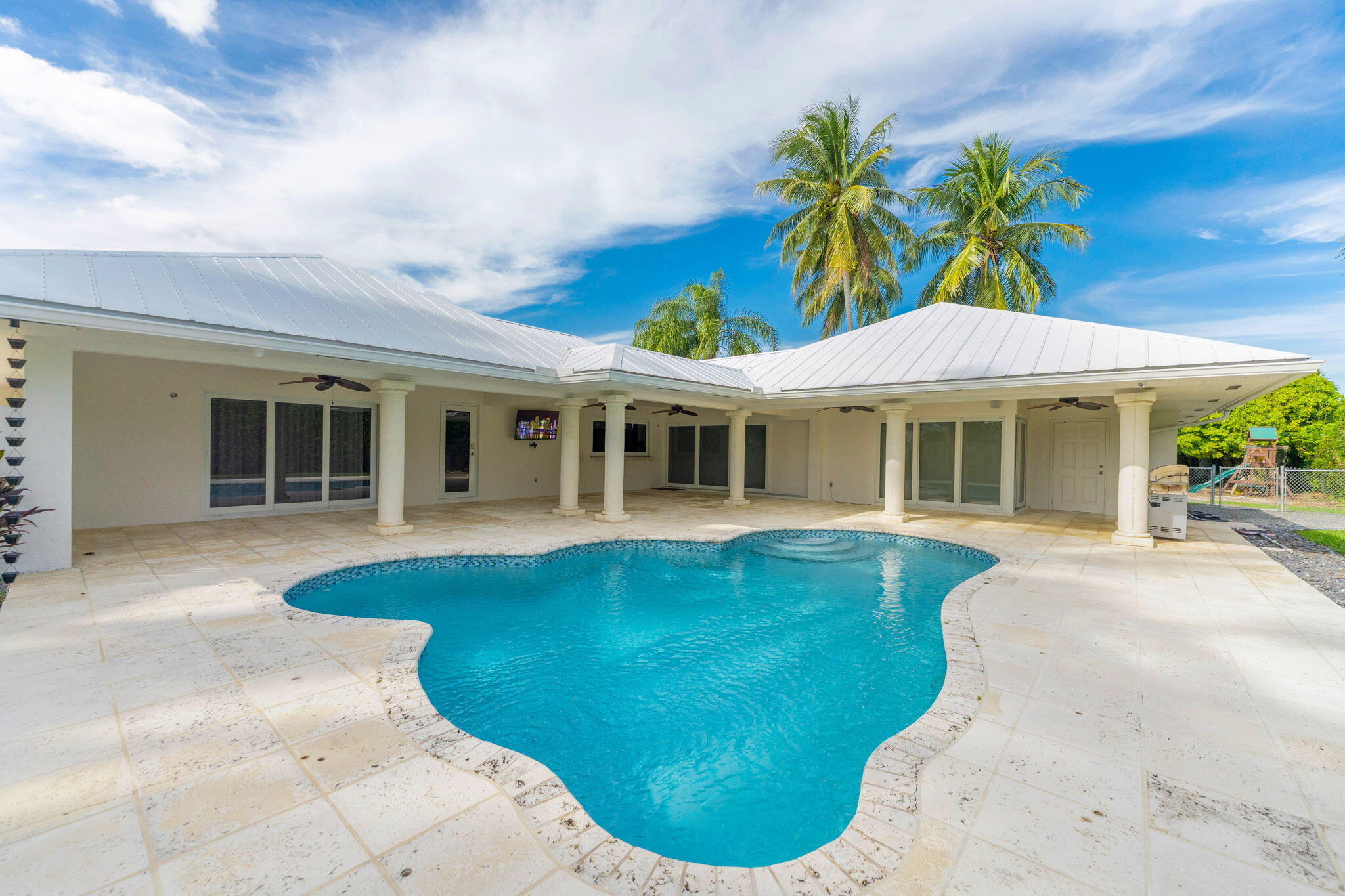 16941 Southwest 278th Street Homestead, FL 33031 - Photo 7 of 44 a view of a house with a swimming pool
