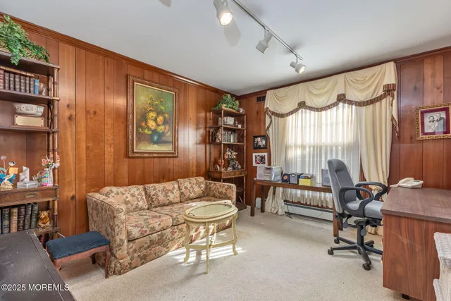a spacious bathroom with a granite countertop sink and a mirror
