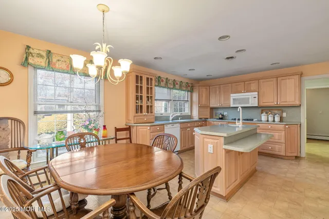 a kitchen with sink stove and cabinets