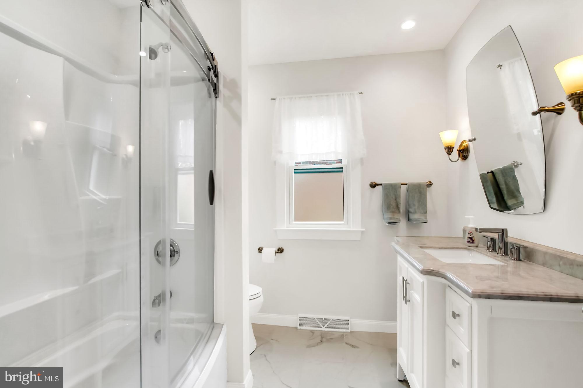 411 Devon Road York, PA 17403 - Photo 16 of 44 Custom tub, shower & doors, updated sink area