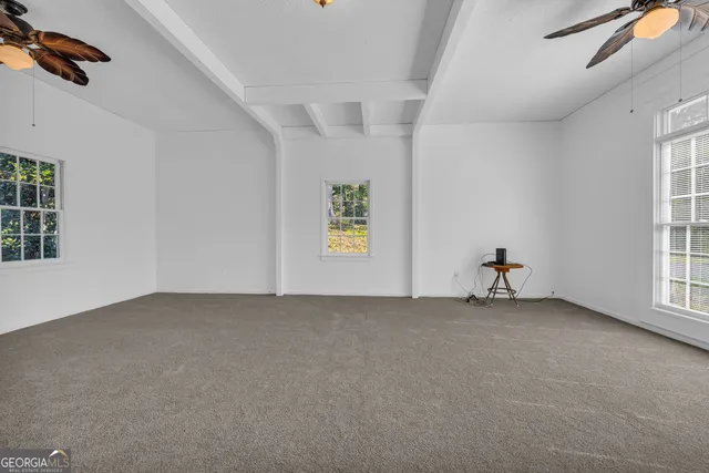 a living room with fireplace furniture and a flat screen tv