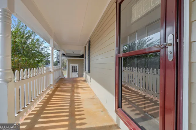 a view of a balcony with wooden floor