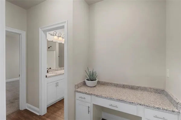 a view of bathroom with a sink and mirror