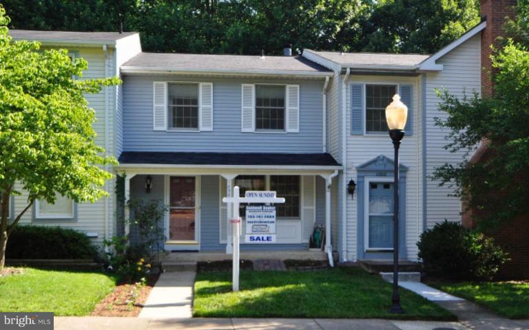 10902 Harpers Square Court Reston, VA 20191 - Photo 1 of 19 a front view of a house with garden