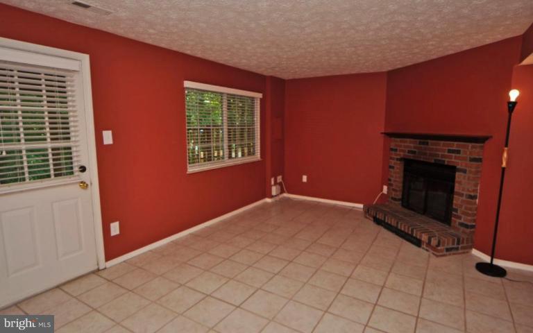 10902 Harpers Square Court Reston, VA 20191 - Photo 11 of 19 a view of empty room with fireplace