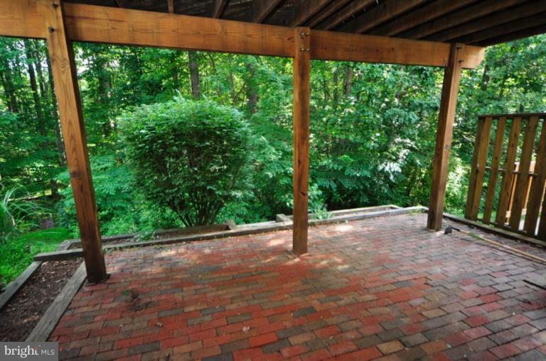 10902 Harpers Square Court Reston, VA 20191 - Photo 14 of 19 a view of a backyard with a large tree