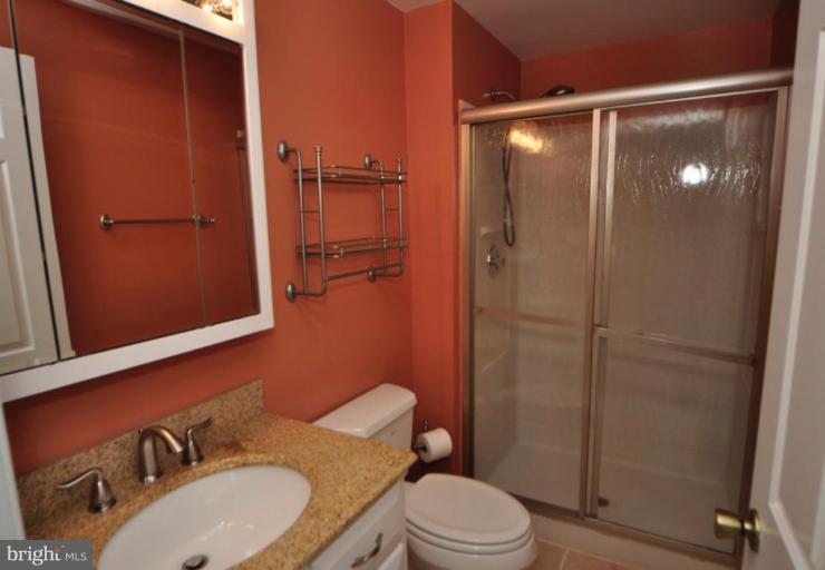 10902 Harpers Square Court Reston, VA 20191 - Photo 17 of 19 a bathroom with a sink toilet and shower