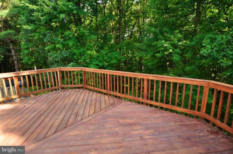 10902 Harpers Square Court Reston, VA 20191 - Photo 9 of 19 a view of wooden deck and a garden