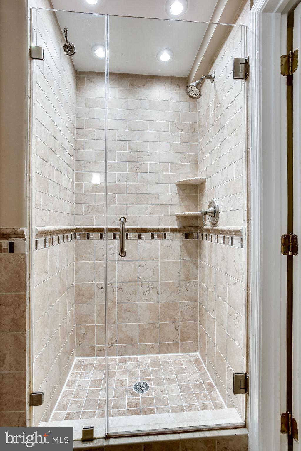 10851 Grovehampton Court Reston, VA 20194 - Photo 35 of 49 a bathroom with a shower