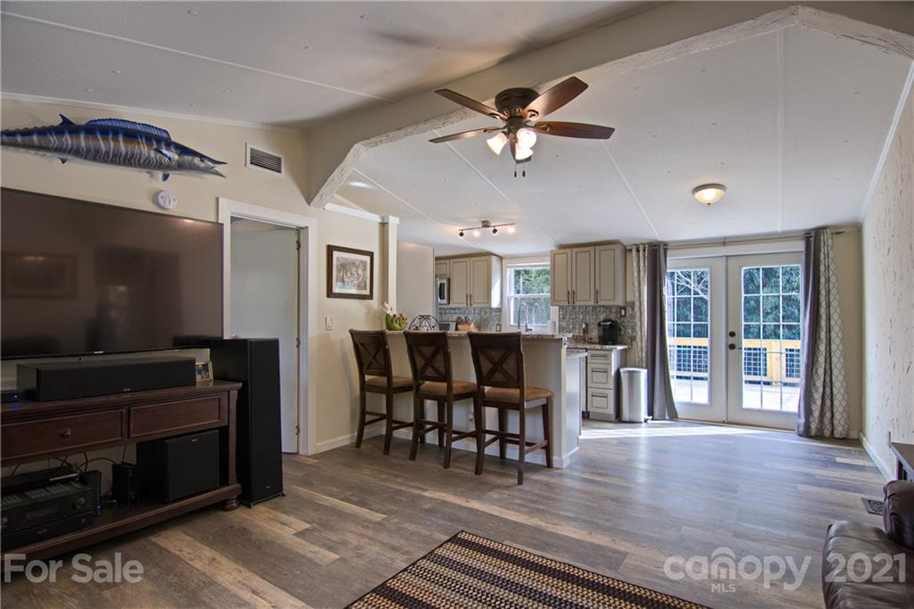 73 Church Road Fairview, NC 28730 - Photo 12 of 45 a view of a livingroom with furniture window and wooden floor
