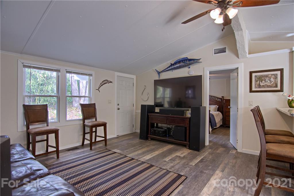 73 Church Road Fairview, NC 28730 - Photo 13 of 45 a living room with furniture and a flat screen tv