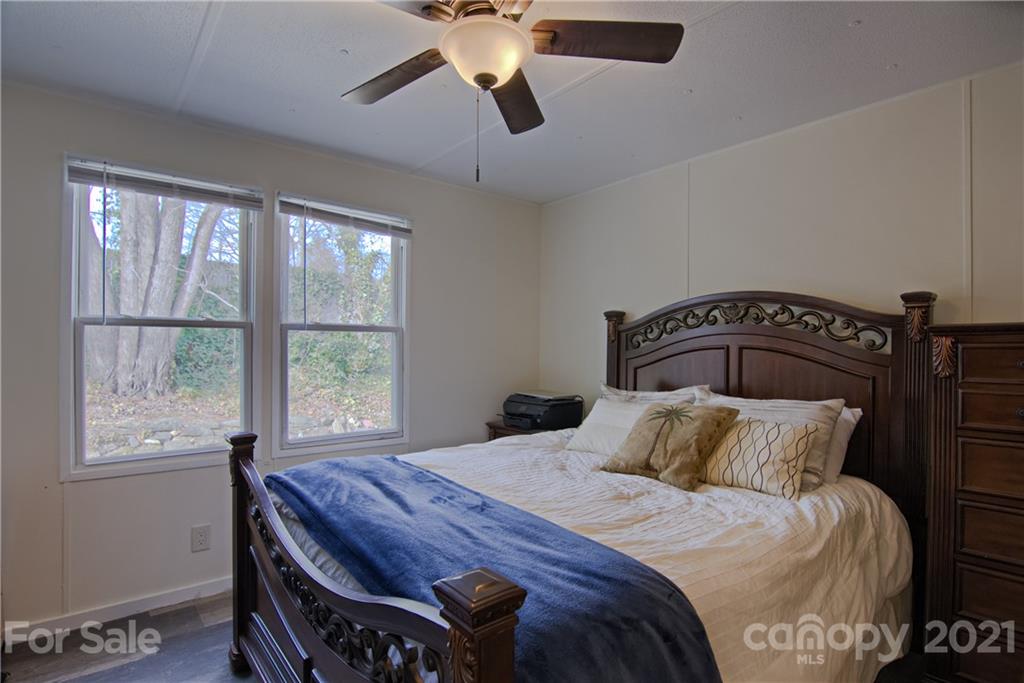 73 Church Road Fairview, NC 28730 - Photo 15 of 45 a bedroom with a bed and window