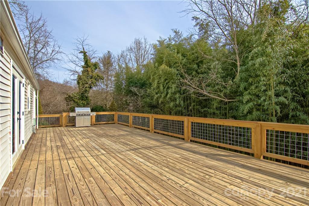 73 Church Road Fairview, NC 28730 - Photo 24 of 45 a view of a balcony with wooden floor and fence