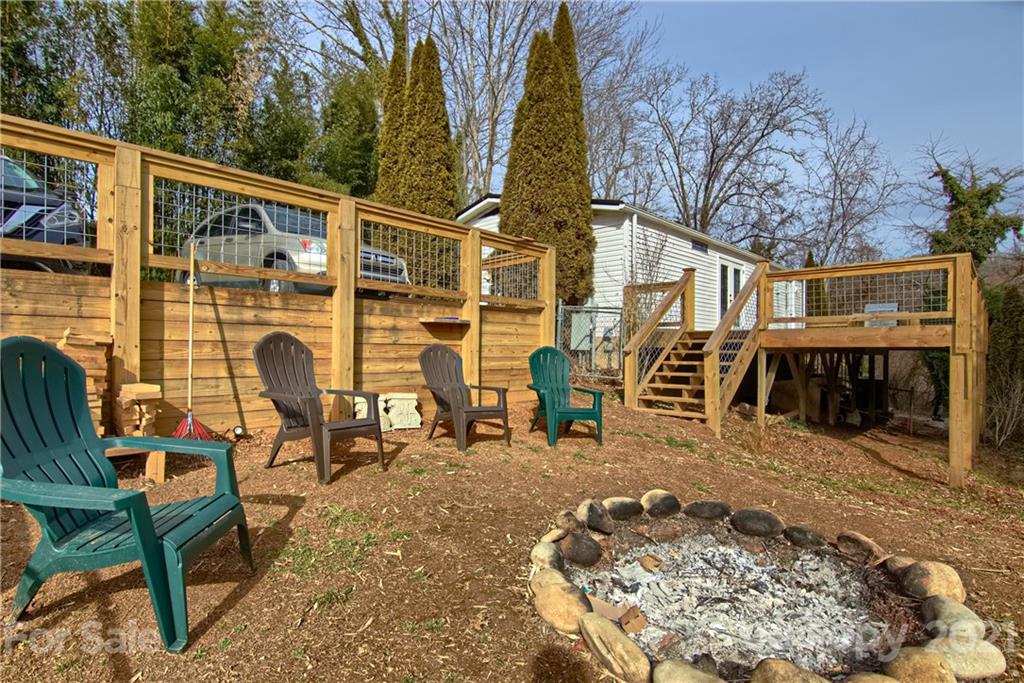 73 Church Road Fairview, NC 28730 - Photo 26 of 45 a backyard of a house with table and chairs