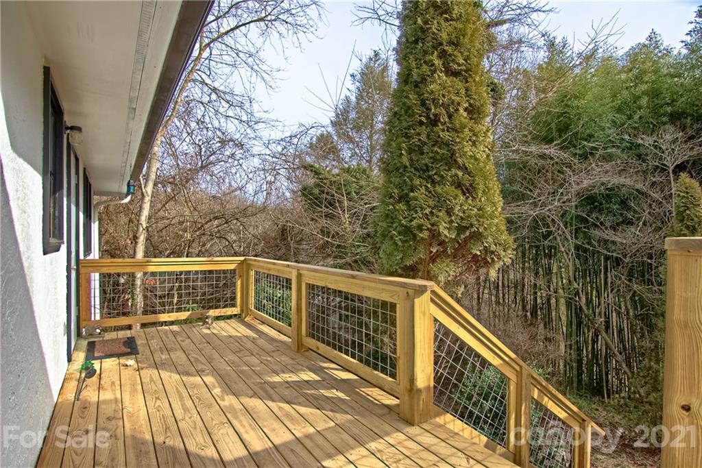 73 Church Road Fairview, NC 28730 - Photo 27 of 45 a view of balcony with wooden floor and fence