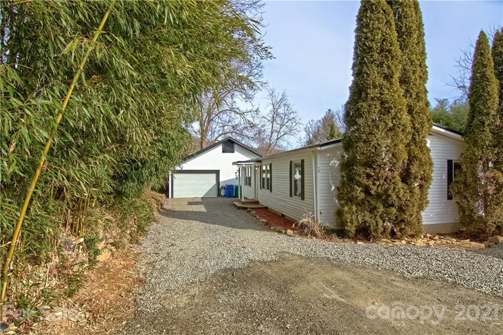 73 Church Road Fairview, NC 28730 - Photo 29 of 45 front view of a house with a yard