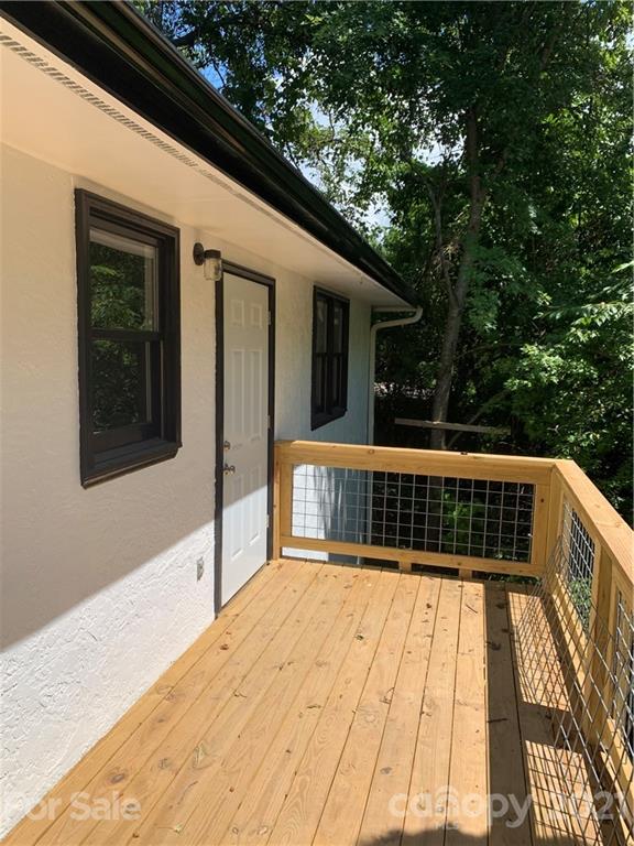 73 Church Road Fairview, NC 28730 - Photo 45 of 45 a view of balcony with wooden floor and fence