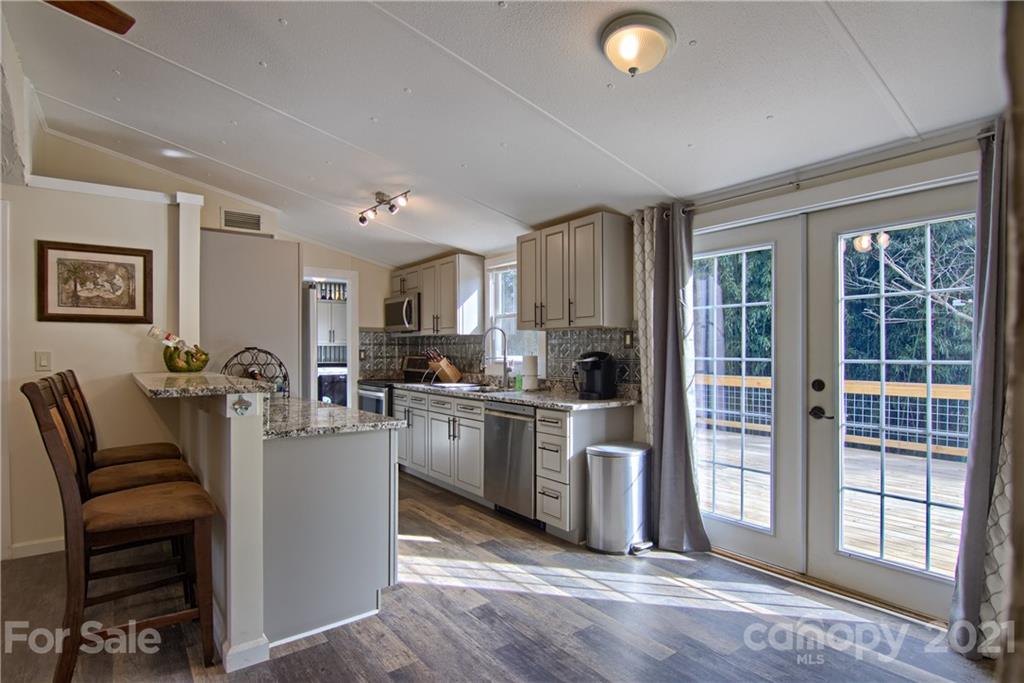 73 Church Road Fairview, NC 28730 - Photo 7 of 45 a view of kitchen with sink refrigerator and microwave