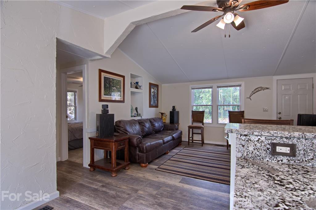 73 Church Road Fairview, NC 28730 - Photo 9 of 45 a living room with furniture and a wooden floor