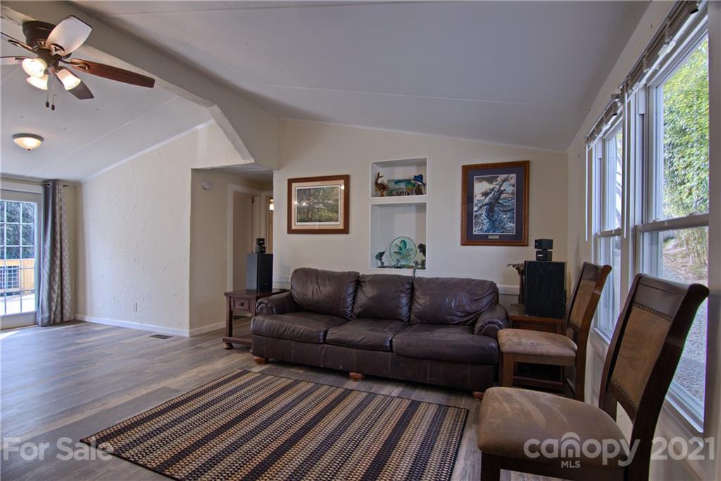 73 Church Road Fairview, NC 28730 - Photo 10 of 45 a living room with furniture fireplace and a window