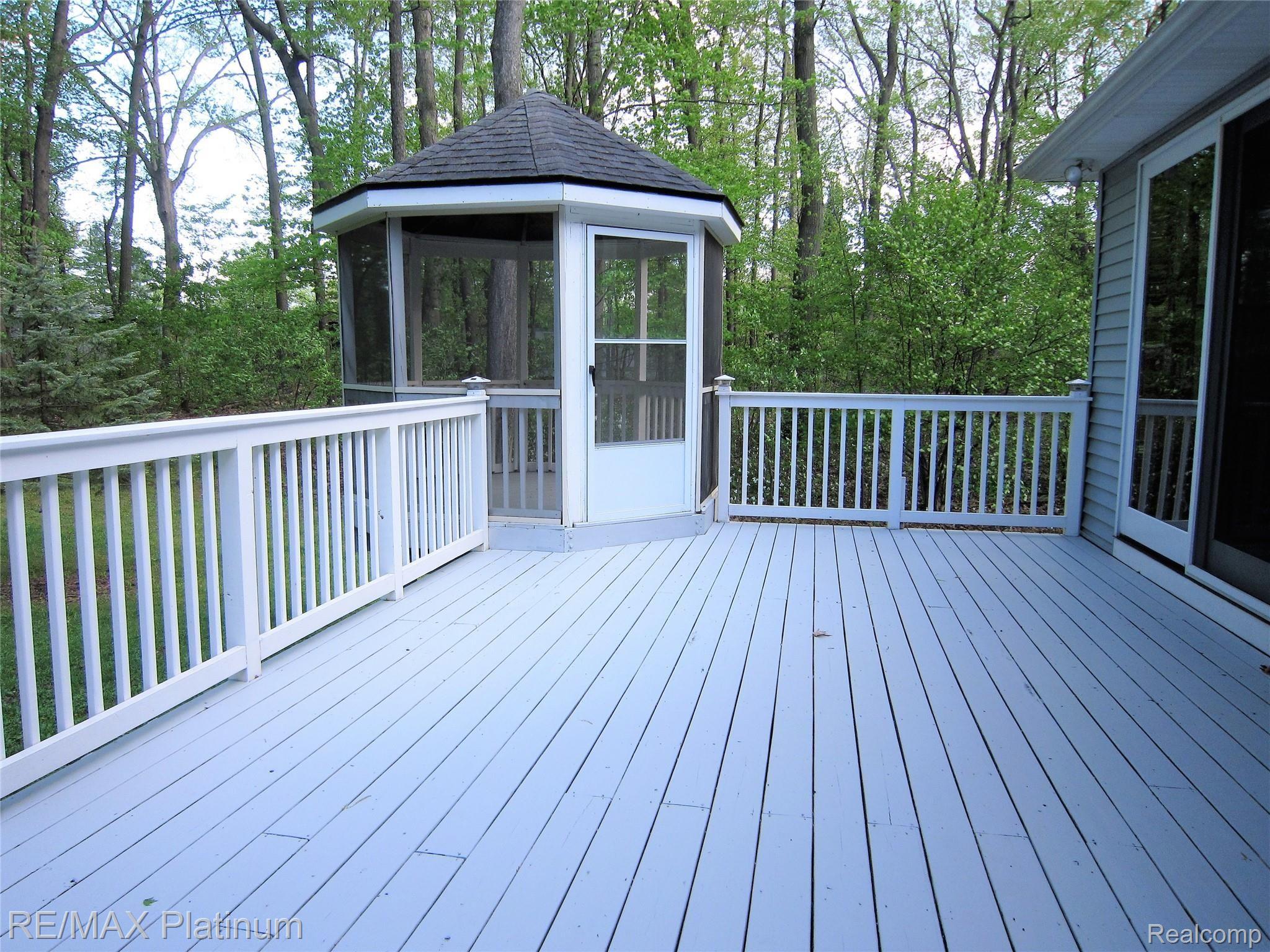 5834 Mack Road Howell, MI 48855 - Photo 9 of 53 Spacious deck and screened gazebo