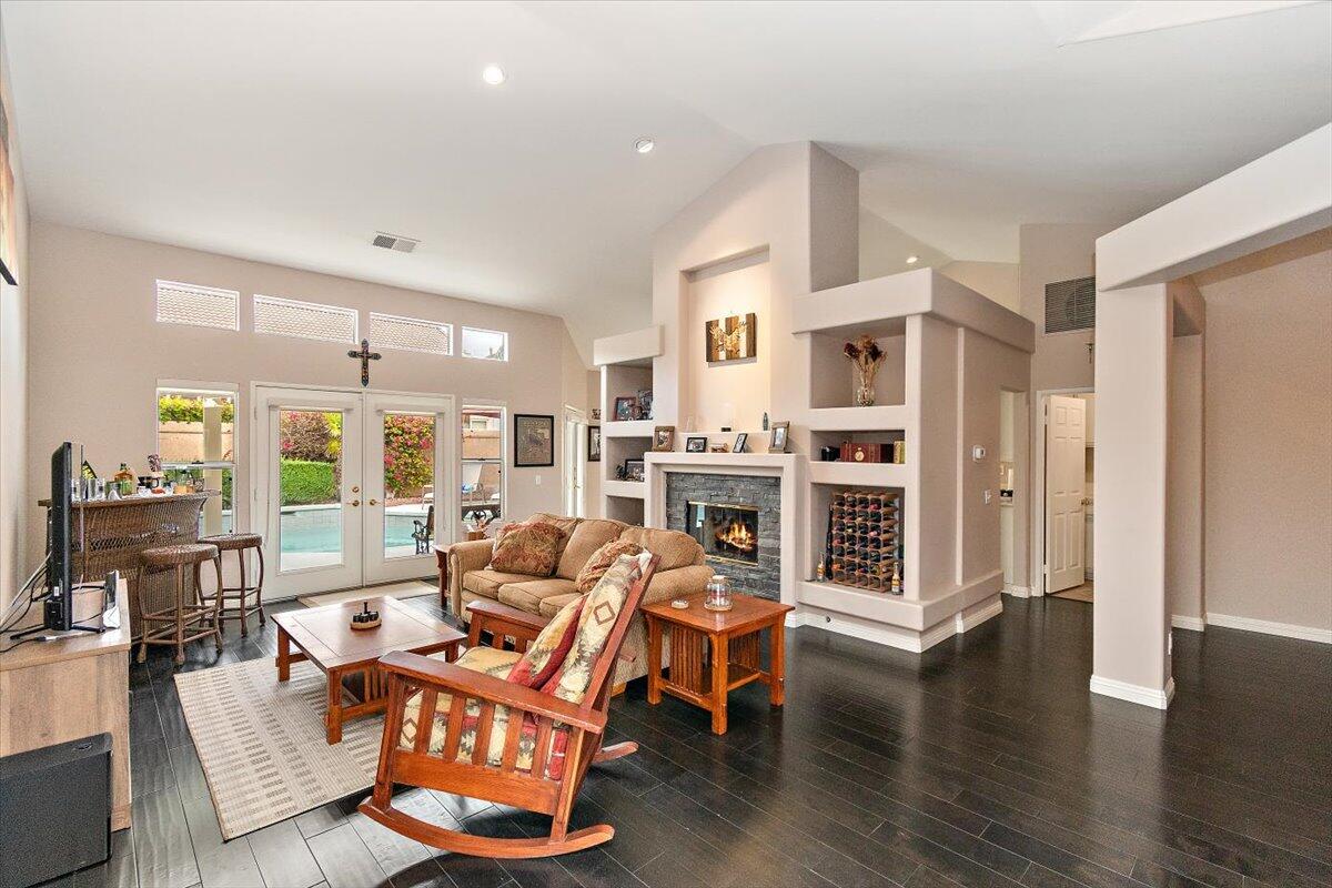 45510 Desert Fox Drive La Quinta, CA 92253 - Photo 14 of 49 a living room with furniture wooden floor and kitchen view
