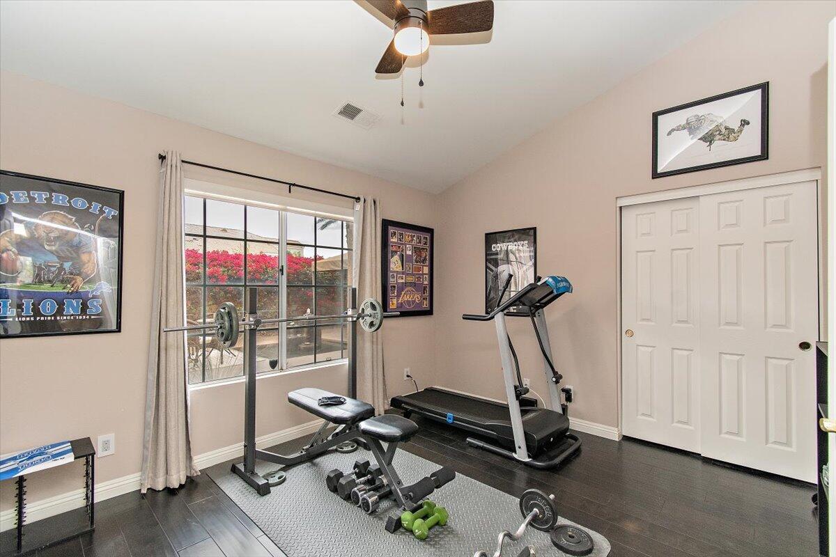 45510 Desert Fox Drive La Quinta, CA 92253 - Photo 30 of 49 a room with gym equipment and a view of living room