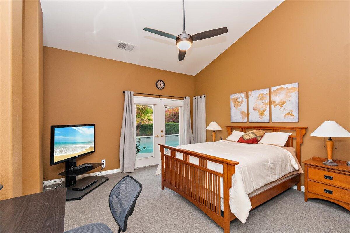 45510 Desert Fox Drive La Quinta, CA 92253 - Photo 36 of 49 a bedroom with a bed window and a flat screen tv