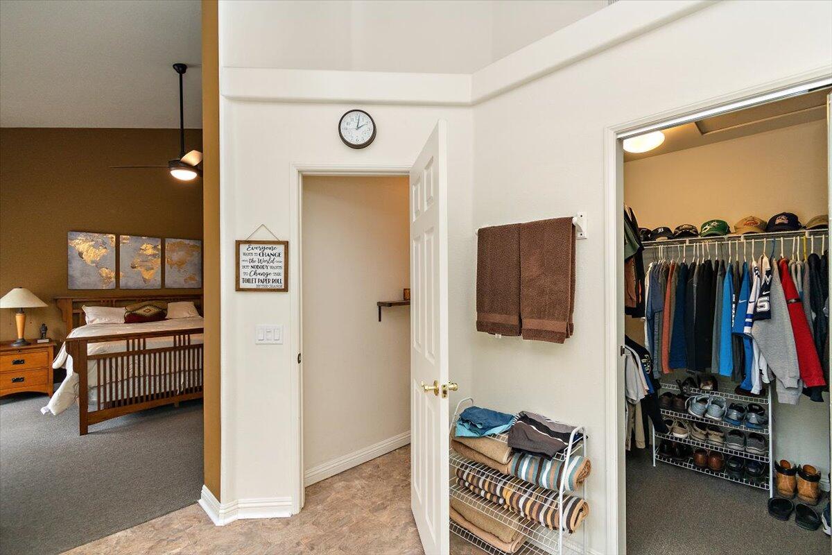45510 Desert Fox Drive La Quinta, CA 92253 - Photo 41 of 49 a view of walk in closet with clothes and shoes