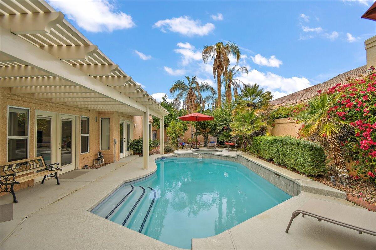 45510 Desert Fox Drive La Quinta, CA 92253 - Photo 43 of 49 a view of a house with swimming pool and sitting area