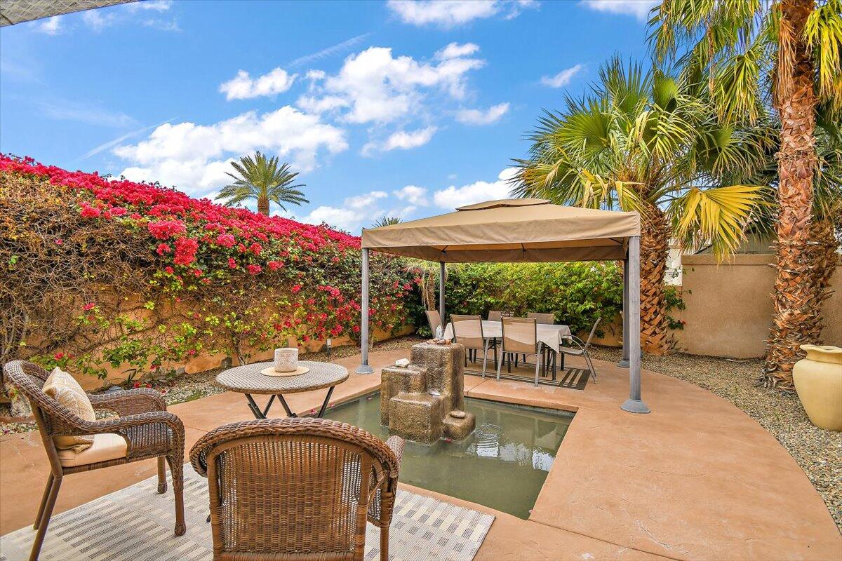 45510 Desert Fox Drive La Quinta, CA 92253 - Photo 7 of 49 a view of a patio with swimming pool